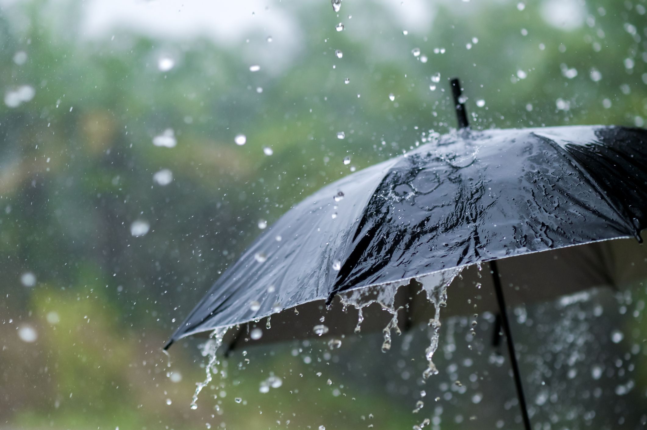 its-raining-heavily-wearing-an-umbrella-during-the-royalty-free-image-1660153348